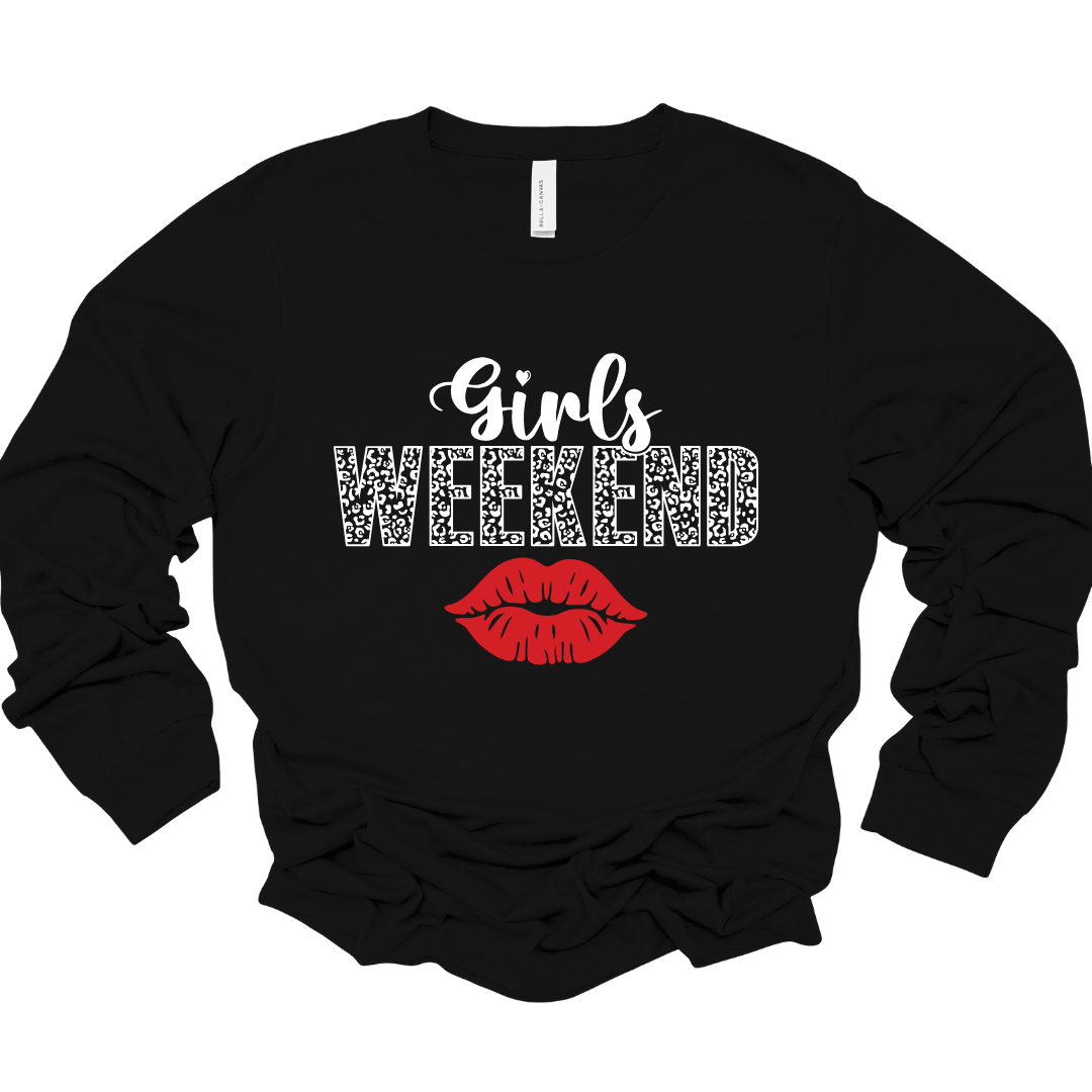 Black unisex long sleeve shirt with white leopard-print “Girls Weekend” text and red lips graphic.