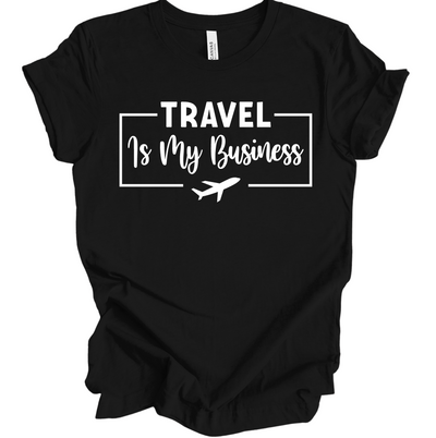 Black unisex t-shirt with white text reading "Travel Is My Business" and an airplane graphic.